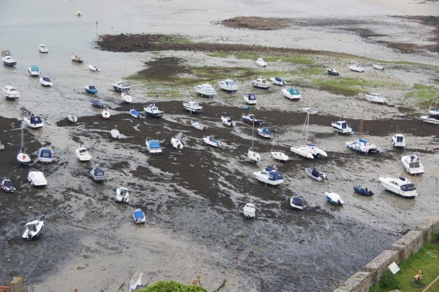 Out of their depths: boats in the bay of St. Martin at low tide 
